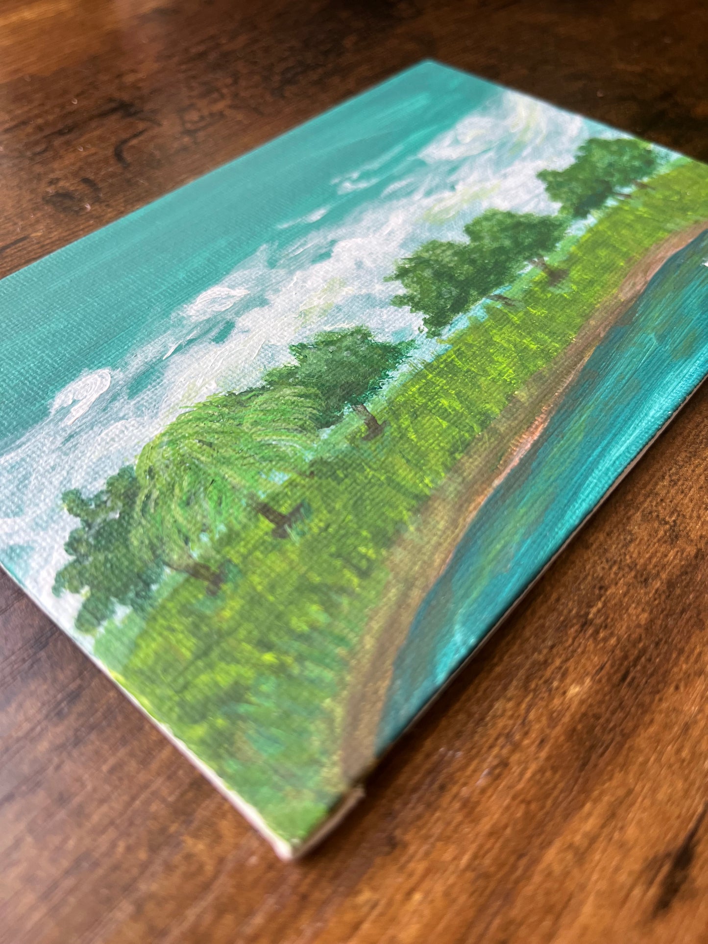 Side view of pond landscape painting